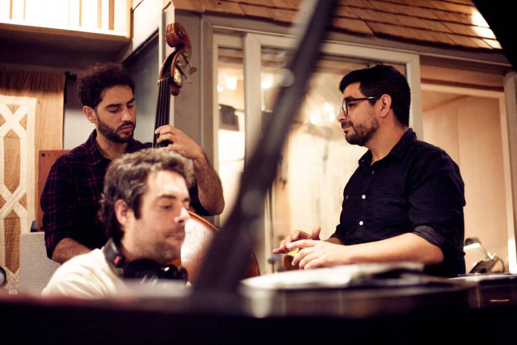 Menares, Vazquez and Recabarren playing in the studio.